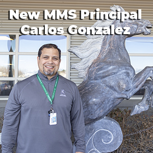  Carlos standing in front of McFarland Mustang Statute